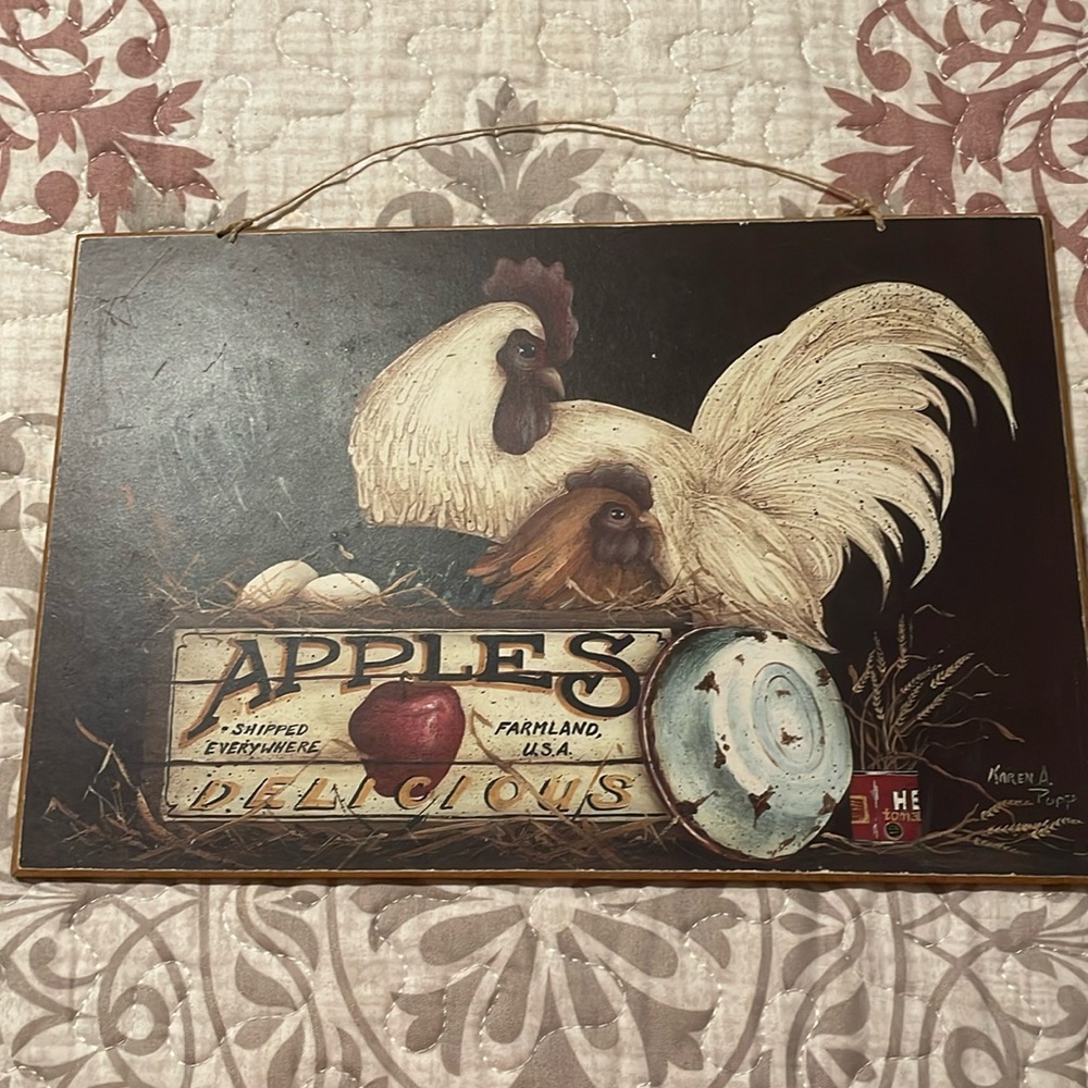 Chicken sign that says apples, delicious shipped everywhere, farmland USA